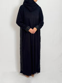 Abaya noire élégante et chic avec dos en brocard et rappel sur les manches 